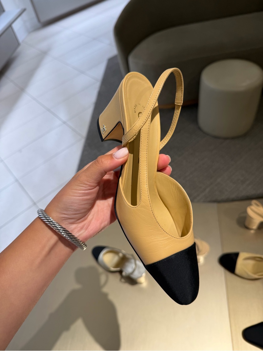 Chanel classic tan and black slingback
